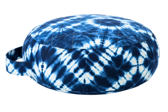 Round blue tie-dye zafu cushion for meditation or yoga practice on isolated background