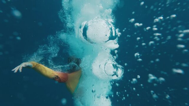 Person jumps into the sea from a boat