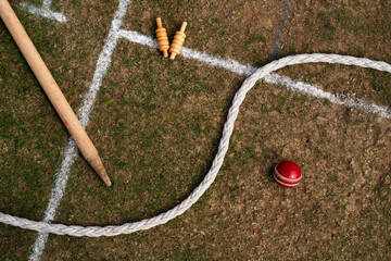 Cricket Scene featuring stump, bails, boundary rope and ball