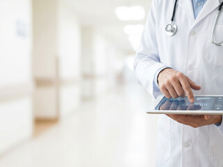 Healthcare technology and digital medicine concept with doctor using tablet to analyze patient data in hospital.