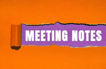 Meeting Notes message written on ripped torn paper background. Conceptual Meeting Notes symbol....
