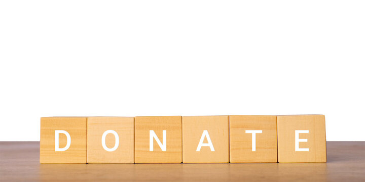 Wooden blocks with word donate for charity support concept, isolated on transparent background