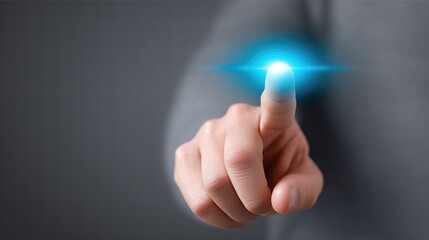 Index Finger Touching Virtual Blue Light Interface. Dark Background. Futuristic Digital Technology