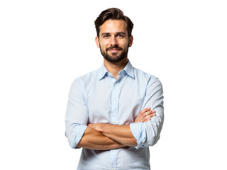 Smiling man in a light blue shirt standing confidently with arms crossed in a neutral background