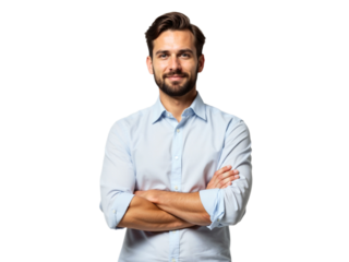 Smiling man in a light blue shirt standing confidently with arms crossed in a neutral background