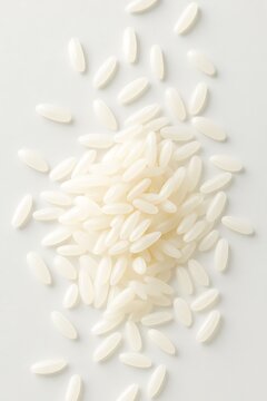 Polished White Rice Grains Scattered On Off-White Background