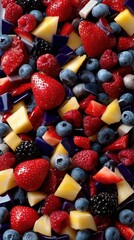 Obraz premium Overhead shot of a vibrant mix of fresh fruits including strawberries, blueberries, raspberries, blackberries, and pineapple.