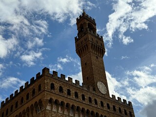 Sky clouds over Palazzo vecchio Piazza della Signoria, Florence, Italy.