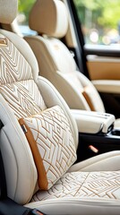 Close-up of luxurious car seats with intricate geometric stitching, featuring a headrest pillow. The interior is bathed in natural light, suggesting a sunny day