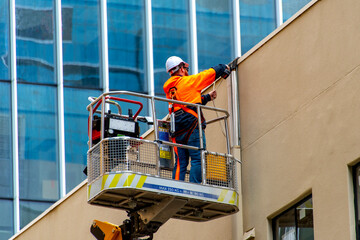Electrician Working in a Boom Lift © Adwo