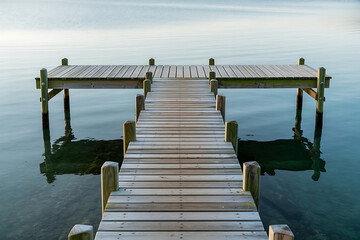 Wooden Pier on Calm Water with Gentle Ripples dock