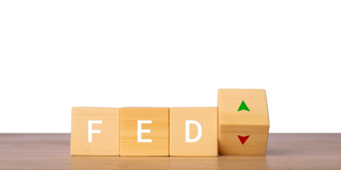 Wooden blocks with FED letters and up down arrows for interest rate decision concept, isolated on transparent background