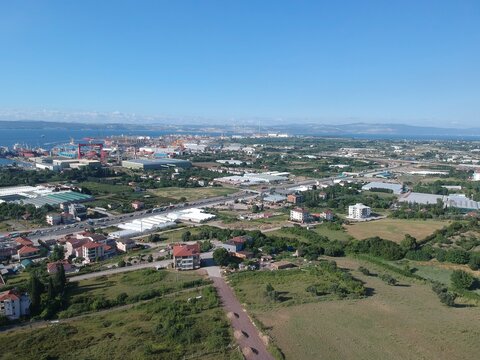 
Aerial drone view over Yalova, Turkey, showcasing natural landscapes transitioning from lush greenery to mountain scenery, with a glimpse of Koru Köy village. Scenic nature, coastal environment, and 