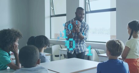 Holding American football, teacher in plaid shirt teaching STEM in classroom with binary hologram