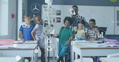 Gathering teacher wearing checked top and students touching skeleton at classroom, with tablet, AR