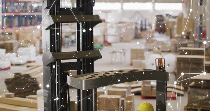 Showing forklift mast, carriage moving in warehouse, amber beacon, yellow hardhat, IoT overlay