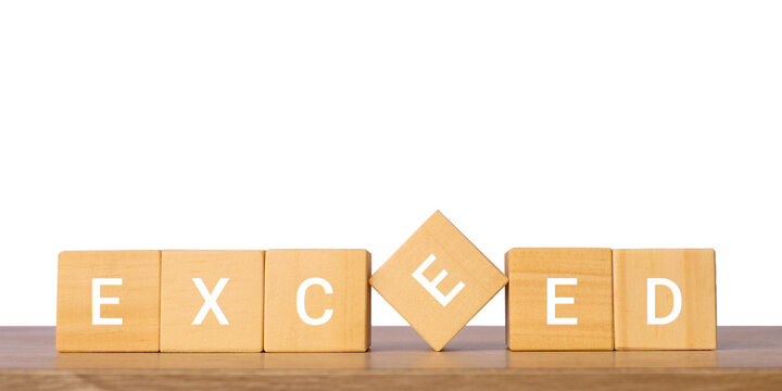 Wooden blocks with exceed word for overachievement and success concept, isolated on transparent background