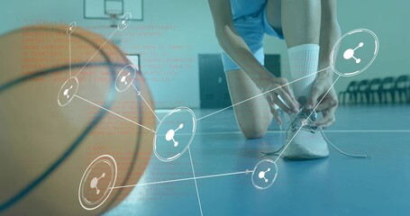 Tying female athlete kneeling on blue court, tying shoelace, wearing crew socks, basketball overlay
