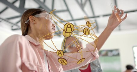 Examining orange liquid in test tube, woman wearing pink shirt, goggles in lab with golden overlay