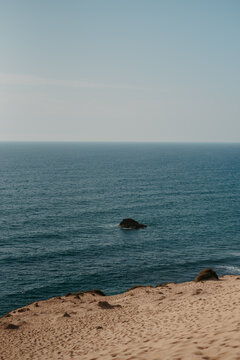 Sand Dunes Overlooking the Atlantic Ocean at Timlaline Desert, Morocco