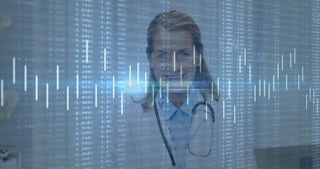 Fototapeta premium Standing doctor facing in clinic wearing lab coat, collared shirt and stethoscope with data overlay