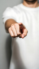 A man pointing his finger directly at the viewer.