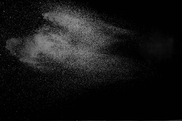 The falling white snow on a black background