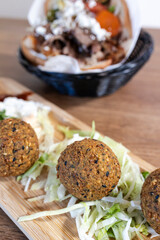 Falafel balls and mediterranean gyro sandwich lunch