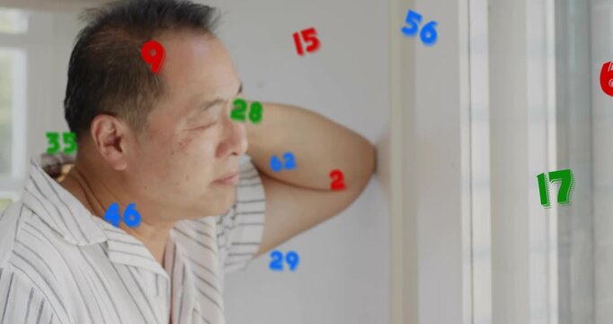Man lowering gaze holding head by vertical blinds as numbers appearing showing finance strain
