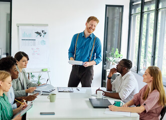 Group of young business people having a meeting or presentation and seminar with whiteboard in the office. Portrait of a young business man leader