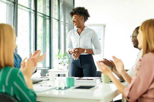 Group of young business people having a meeting or presentation and seminar with whiteboard in the office. Portrait of a young business woman - Powered by Adobe