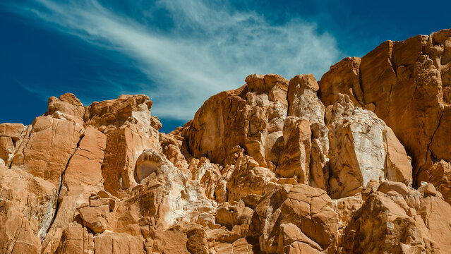 landscape of rocky mountains and desert and sky on a sunny day in Egyp