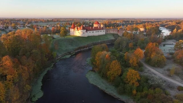 Bauska Medieval Castle by the Memele River in Latvia on a cold autumn morning