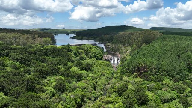 Aerial drone view of Divisa Dam in S&atilde;o Francisco de Paula, Brazil. Lush forest and calm reservoir waters. Ideal for nature, travel or environmental projects.