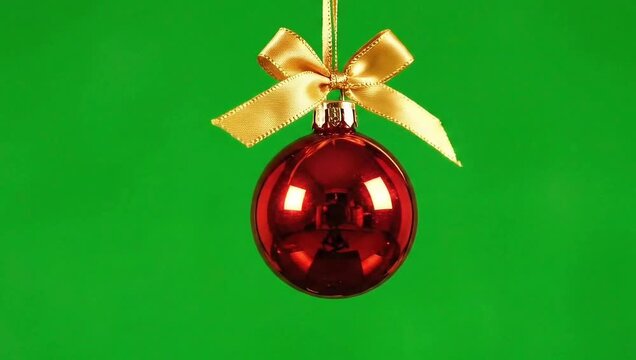 3D animated festive Christmas ball swinging and rotating with green screen background