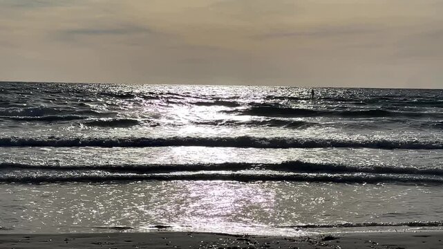 Paguera beach with strong wind , high Waves and Surfer, Calvia, Mallorca, Spain