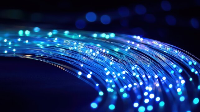 Curved fiber glow light trails blue illuminated optic cables graceful flowing arcs dark background modern technology network
