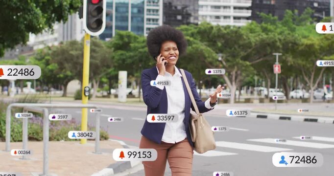Businesswoman walking across crossing on phone, call sending icons clustering around her