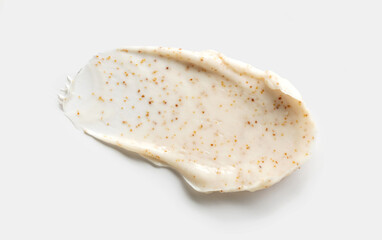 sample smear of cosmetic peeling cream on a light gray background close-up