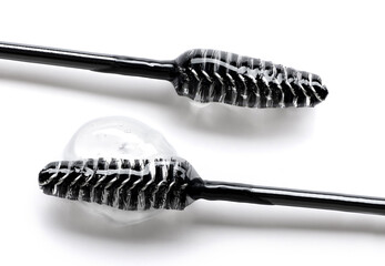 Close-up photo of Essence serum gel for eyebrows and eyelashes on a brush
