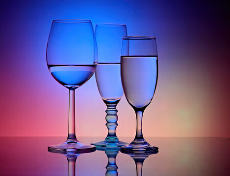 Three different goblets with colorful background