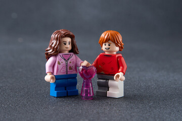 Naklejka premium Love forever Ron and Hermione. Lego man Harry Potter mini figures toy bricks. Ukraine, Kyiv - January 17, 2024