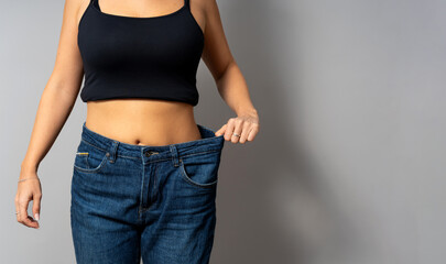 Woman showing body transformation after weight loss