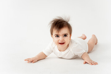 cute baby on a white isolated background, space for text, baby boy in a white bodysuit smiling