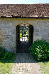 Decorative Iron Gate on the Grounds of Cowdray Estate in Midhurst, West Sussex