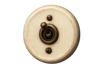 Vintage style toggle light switch featuring a round, off-white ceramic base and a brass lever, controlling electricity