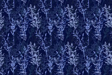 Seamless vector pattern with dense abstract botanical stems in layered cool blue tones on a deep navy background, creating an elegant, moody and nature inspired decorative design