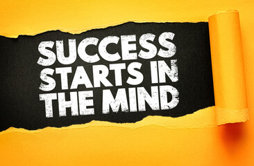 Motivational phrase SUCCESS STARTS IN THE MIND revealed under torn yellow paper on black background. Bold distressed text emphasizes mental strength and mindset for personal growth