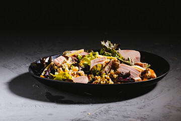 Bowl of salad with tuna steak