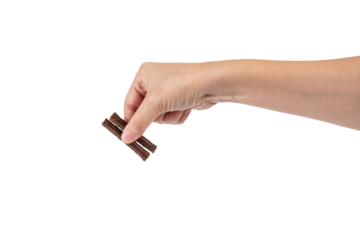 Chocolate bar in hand on transparent background